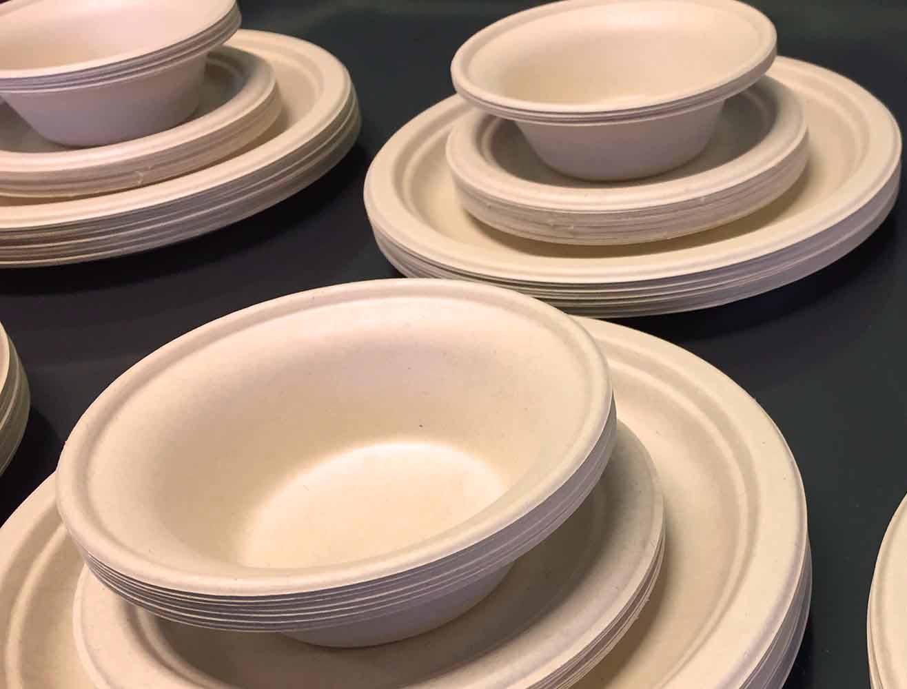 Molded fiber plates and bowls stacked together